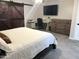 Bedroom featuring a barn door and a TV at 718 W Paseo Way, Tempe, AZ 85283