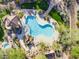 Aerial view of a resort style pool and patio with lush landscaping and seating at 7445 E Eagle Crest Dr # 1094, Mesa, AZ 85207