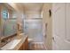 Well-lit bathroom featuring a glass-enclosed shower, granite countertop, and neutral finishes at 7445 E Eagle Crest Dr # 1094, Mesa, AZ 85207