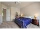 Spacious bedroom with neutral tones, large windows, and a comfortable bed at 7445 E Eagle Crest Dr # 1094, Mesa, AZ 85207