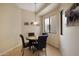 Cozy dining area with pendant lighting and windows for natural light at 7445 E Eagle Crest Dr # 1094, Mesa, AZ 85207