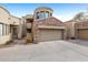 Beautiful two story home featuring a stone garage and a private drive at 7445 E Eagle Crest Dr # 1094, Mesa, AZ 85207