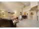 Open-concept living area with dining and kitchen views, featuring neutral décor and comfortable furniture at 7445 E Eagle Crest Dr # 1094, Mesa, AZ 85207