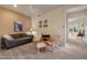Inviting living room with a comfortable sofa, two armchairs, and soft neutral tones throughout at 7445 E Eagle Crest Dr # 1094, Mesa, AZ 85207