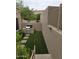 Outdoor patio area with artificial turf, built in barbeque, and privacy wall at 7445 E Eagle Crest Dr # 1094, Mesa, AZ 85207