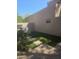 Outdoor patio with built in barbeque, artificial turf, stepping stones, and privacy wall at 7445 E Eagle Crest Dr # 1094, Mesa, AZ 85207