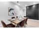 An elegant dining room set under modern lighting features stylish decor and wall art at 790 E San Carlos Way, Chandler, AZ 85249