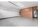 Clean garage interior offers a sealed floor, ample storage cabinets and a functional space at 790 E San Carlos Way, Chandler, AZ 85249