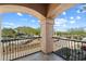 This balcony features an archway and views of the street and desert landscape at 9515 E Julep Cir, Mesa, AZ 85207