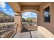 This balcony features an archway and views of the desert landscape at 9515 E Julep Cir, Mesa, AZ 85207