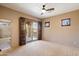 Bedroom showcasing access to a balcony with scenic views, with shuttered windows and a ceiling fan at 9515 E Julep Cir, Mesa, AZ 85207