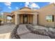 Inviting front entrance featuring stone arches and a brick walkway at 9515 E Julep Cir, Mesa, AZ 85207