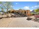 Beautiful home featuring a circular driveway and professionally landscaped yard at 9515 E Julep Cir, Mesa, AZ 85207