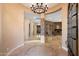 Grand foyer with stone accents, high ceilings, and elegant chandelier at 9515 E Julep Cir, Mesa, AZ 85207