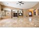 Spacious open-concept living room with stone pillars and tiled floors at 9515 E Julep Cir, Mesa, AZ 85207