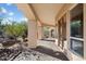 This covered patio features elegant columns and views of the desert landscape at 9515 E Julep Cir, Mesa, AZ 85207