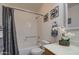 Cozy bathroom featuring a shower/tub combo, toilet, vanity, and decorative accents at 1021 S Greenfield Rd # 1142, Mesa, AZ 85206