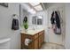 Bathroom featuring a vanity, toilet, and a door with a robe rack at 1021 S Greenfield Rd # 1142, Mesa, AZ 85206