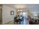 Charming dining area features a bay window and an elegant chandelier to make a welcoming spot for meals at 1021 S Greenfield Rd # 1142, Mesa, AZ 85206