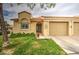 Inviting single-story home featuring a manicured lawn and a two-car garage at 1021 S Greenfield Rd # 1142, Mesa, AZ 85206