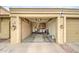 Spacious garage with ample storage cabinets and an open layout for parking and projects at 1021 S Greenfield Rd # 1142, Mesa, AZ 85206