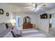 Spacious main bedroom featuring en suite bathroom, dresser with mirror, and mirrored closet doors at 1021 S Greenfield Rd # 1142, Mesa, AZ 85206