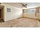 Damaged bedroom shows bare floors, dirty walls, and an old window at 1048 E 2Nd Pl, Mesa, AZ 85203