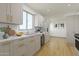 Bright kitchen features white marble countertops and stainless steel appliances at 1048 E 2Nd Pl, Mesa, AZ 85203