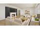 Contemporary living room featuring a fireplace and elegant furniture, creating a welcoming space at 1048 E 2Nd Pl, Mesa, AZ 85203