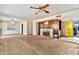 Spacious living room awaiting renovation featuring a vintage fireplace and dated decor at 1048 E 2Nd Pl, Mesa, AZ 85203