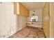 This abandoned room features an outdated vanity and damaged walls at 1048 E 2Nd Pl, Mesa, AZ 85203