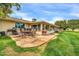 Inviting patio area with comfortable seating, ideal for enjoying the well-manicured backyard at 10646 W Tropicana Cir, Sun City, AZ 85351