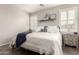 Bright and cozy bedroom featuring a neutral palette, a ceiling fan, and shuttered windows at 10960 E Monte Ave # 286, Mesa, AZ 85209