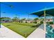 Outdoor bocce ball court with benches and a canopy at 10960 E Monte Ave # 286, Mesa, AZ 85209