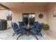 Covered patio features a cozy dining area with seating for four at 10960 E Monte Ave # 286, Mesa, AZ 85209