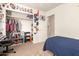 Bedroom featuring neutral carpet, gamer decor and desk space, offering a comfortable and functional space at 11330 W Eden Mckenzie Dr, Surprise, AZ 85378