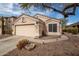 Charming one-story home featuring a two-car garage and low-maintenance desert landscaping at 11330 W Eden Mckenzie Dr, Surprise, AZ 85378