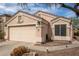 Charming one-story home featuring a two-car garage and low-maintenance desert landscaping at 11330 W Eden Mckenzie Dr, Surprise, AZ 85378