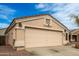 Charming one-story home featuring a two-car garage and low-maintenance desert landscaping at 11330 W Eden Mckenzie Dr, Surprise, AZ 85378