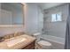 This bathroom features a granite countertop, a large mirror, and a shower and tub combination at 1137 E Mcmurray Blvd, Casa Grande, AZ 85122