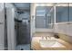 Updated bathroom featuring tiled shower with rainfall shower head and modern vanity at 1137 E Mcmurray Blvd, Casa Grande, AZ 85122