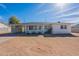 Charming single-Gathering home featuring a carport, welcoming front porch, and desert landscaping at 1137 E Mcmurray Blvd, Casa Grande, AZ 85122