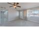 Bright and airy living room with tile flooring, ceiling fan, and lots of natural light at 1137 E Mcmurray Blvd, Casa Grande, AZ 85122