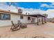 Seating area in the backyard featuring a covered patio and home's exterior at 11403 N 57Th Dr, Glendale, AZ 85304