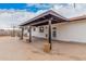 Covered backyard patio featuring stained wood and the home's exterior at 11403 N 57Th Dr, Glendale, AZ 85304