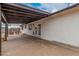 View of covered patio featuring stained wood and the home's exterior at 11403 N 57Th Dr, Glendale, AZ 85304