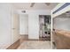 Bright bedroom featuring an open closet, a bunk bed and a plush rug over hardwood flooring at 11403 N 57Th Dr, Glendale, AZ 85304