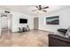 Bright living room with tile floors, a ceiling fan, and plenty of natural light at 11403 N 57Th Dr, Glendale, AZ 85304