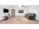 Open living room featuring tile floors, a ceiling fan, and a neutral color palette at 11403 N 57Th Dr, Glendale, AZ 85304