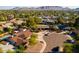 A neighborhood shot with mature trees, pools, and solar panels in close proximity to local services at 11431 N 37Th Pl, Phoenix, AZ 85028